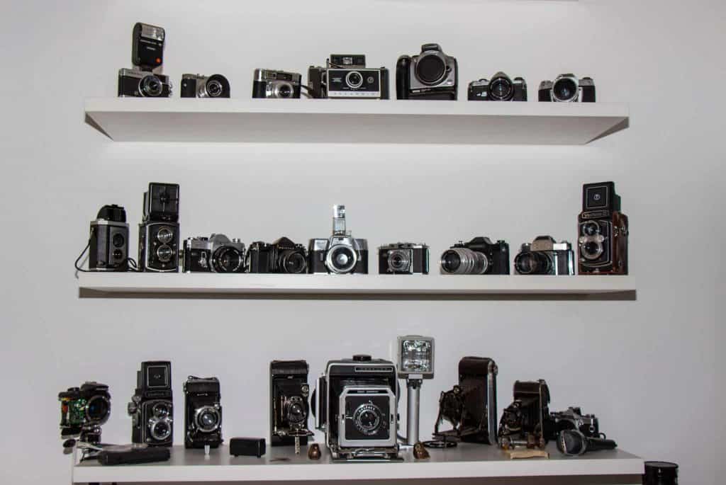 Collection of Cameras on Shelves