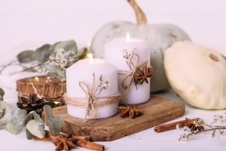 Home %comfy cozy home% Autumn composition with pumpkin and candles. Beautiful autumn decor