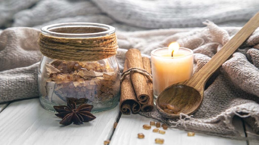Composition-with-candle-cinnamon-sticks-closeup for a comfy cozy home